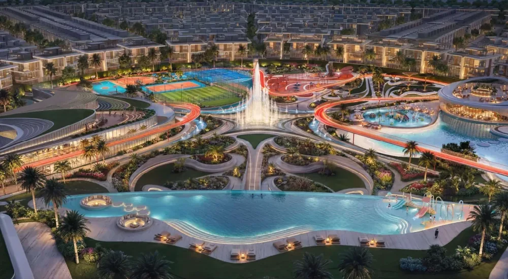 Greenz community at night with pool, fountain and sports courts